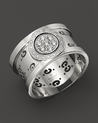 Gucci's iconic Gs circle a gleaming band of 18K. white gold. Gucci's iconic Gs circle a gleaming band of 18K. white gold.