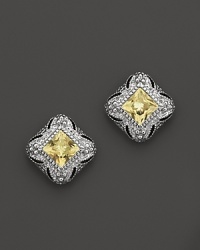 An art-deco style stud earring, in sterling silver with a canary crystal center stone. An art-deco style stud earring, in sterling silver with a canary crystal center stone.