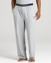 Kick back in total luxe style. Emporio Armani's lounge pants are crafted in a super soft cotton blend for maximum comfort.