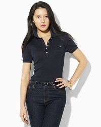 Designed for a classic, feminine fit in soft finely ribbed cotton, this short-sleeved polo shirt is a wardrobe staple. Designed for a classic, feminine fit in soft finely ribbed cotton, this short-sleeved polo shirt is a wardrobe staple.