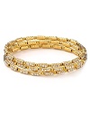 The Seasonal Whispers girl loves to stack the brand's beautifully eclectic bracelets. This set is studded with gold-plated Swarovski crystal bars, creating a cool textured statement.