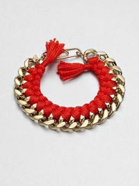 A chunky chain, with the look of a vintage ID bracelet, is modernized with bright red braiding with tassels and a fun paper-clip clasp.GoldplatedCottonLength, about 7.5Spring ring paper clip claspMade in France