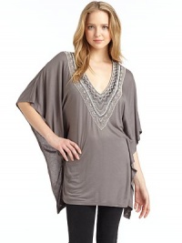 THE LOOKPullover styleV-neck with beaded detailsThree-quarter length dolman sleeves with draped detailTHE FITAbout 32 from shoulder to hemTHE MATERIALViscoseCARE & ORIGINDry cleanImportedModel shown is 5'9½ (176cm) wearing US size Small. 