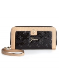 Portable perfection defines this laid-back luxe design from GUESS that's a wallet and wristlet in one. Posh signature embossing and glam, gold-tone hardware make a statement, while the impeccably organized interior offers plenty of credit card pockets and two full billfolds. Portable perfection defines this laid-back luxe design from GUESS that's a wallet and wristlet in one. Posh signature embossing and glam, gold-tone hardware make a statement, while the impeccably organized interior offers plenty of credit card pockets and two full billfolds.