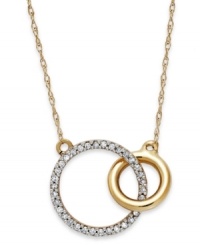 Slightly asymmetrical with a touch of shimmer, this double circle pendant embodies contemporary style. Crafted in 10k gold with sparkling round-cut diamonds adorning the larger circle. Approximate length: 17-1/2 inches. Approximate drop: 1/2 inch.