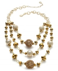 The textured look of Alfani's three-row illusion necklace features gold tone diamond-blast beads, faceted beads and rhinestone chain-wrapped beads. Crafted in 12k gold-plated mixed metal. Approximate length: 19 inches + 3-inch extender. Approximate drop: 3-1/4 inches. The textured look of Alfani's three-row illusion necklace features gold tone diamond-blast beads, faceted beads and rhinestone chain-wrapped beads. Crafted in 12k gold-plated mixed metal. Approximate length: 19 inches + 3-inch extender. Approximate drop: 3-1/4 inches.