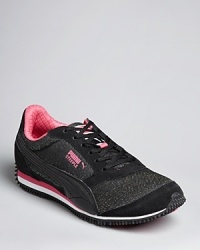 Fast and totally fashionable, PUMA updates their classic running shoe in glorious glitter and colorful trim and accents. Fast and totally fashionable, PUMA updates their classic running shoe in glorious glitter and colorful trim and accents.