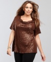 Unique twists at the neckline make a creative touch on INC's plus size top. Mini sequins provide the extra sparkle!