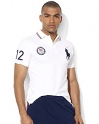 Cut for a trim, modern fit from breathable cotton mesh, a short-sleeved polo shirt is accented with bold country embroidery to celebrate Team USA's participation in the 2012 Olympic Games.