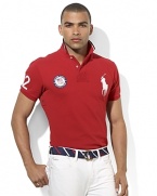 The prestige, tradition and athletic greatness exemplified by the Olympic Games are brought to life in this custom-fit polo adorned with sporty numerals, city text and a flag at the back celebrating Team USA's participation in the 2012 Games.