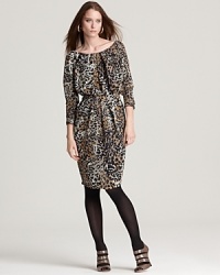 A vivid animal print enlivens sumptuous silk on this Anne Klein New York dress, designed in a draped and pleated silhouette that cinches in at the waist for a flattering finish. A vivid animal print enlivens sumptuous silk on this Anne Klein New York dress, designed in a draped and pleated silhouette that cinches in at the waist for a flattering finish.