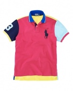 Bold pops of neon impart athletic appeal to a trim, athletic-fitting short-sleeved polo shirt in breathable cotton mesh.