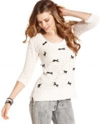 A nubby sweater sprinkled with bows, American Rag's three-quarter sleeve pullover is built for getting cozy in!