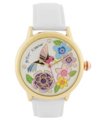 Take some time to smell the flowers. Betsey Johnson brings a nectar-sweet watch crafted of white leather strap and round gold tone stainless steel case. White dial features a multi-color floral and hummingbird graphic, crystal dot markers at twelve, three, six and nine o'clock, gold tone hour and minute hands, signature fuchsia second hand and logo. Quartz movement. Water resistant to 30 meters. Two-year limited warranty. Take some time to smell the flowers. Betsey Johnson brings a nectar-sweet watch crafted of white leather strap and round gold tone stainless steel case. White dial features a multi-color floral and hummingbird graphic, crystal dot markers at twelve, three, six and nine o'clock, gold tone hour and minute hands, signature fuchsia second hand and logo. Quartz movement. Water resistant to 30 meters. Two-year limited warranty.