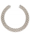 Update your elegant leanings. This collar necklace from Carolee is crafted from silver-tone mixed metal with glass pearls and crystals lending a lustrous touch to this postmodern piece. Approximate length: 15 inches.