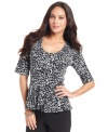 Dress for success in Style&co.'s chic peplum waist top. A fierce cheetah print adds spice to your wardrobe!