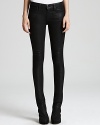 Glossy HELMUT skinny jeans shine the spotlight on your directional style sense for a dose of downtown attitude.