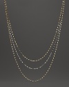 Delicate twisted chains of 14K white and yellow gold.