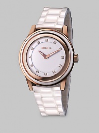 From the Orchestra Collection. A bright timepiece in warm rose goldtone ion-plated stainless steel and shiny ceramic with a dazzling Swarovski crystal markers. Quartz movementWater resistant to 10 ATMRound rose goldtone ion-plated stainless steelcase, 40mm (1.5) Multi-layer stainless steel and rose goldtone ion-plated stainless steel bezelWhite dialSwarovski crystal markersWhite ceramic link braceletImported From the Orchestra Collection. A bright timepiece in warm rose goldtone ion-plated stainless steel and shiny ceramic with a dazzling Swarovski crystal markers. Quartz movementWater resistant to 10 ATMRound rose goldtone ion-plated stainless steelcase, 40mm (1.5) Multi-layer stainless steel and rose goldtone ion-plated stainless steel bezelWhite dialSwarovski crystal markersWhite ceramic link braceletImported