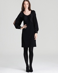 Split raglan sleeves lend chic modernity to Elie Tahari's subtle Corine dress. Split raglan sleeves lend chic modernity to Elie Tahari's subtle Corine dress.
