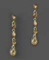 Warm topaz-toned crystal accents shine bright on these beautiful drop earrings by Givenchy. In goldtone mixed metal. Approximate drop: 1-3/4 inches.