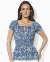 A floral batik-print and soft smocking imbues Lauren Jeans Co.'s featherweight tissue jersey top with a breezy, ethereal quality. A floral batik-print and soft smocking imbues Lauren Jeans Co.'s featherweight tissue jersey top with a breezy, ethereal quality.