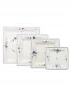 First introduced in 1768, the Vieux Luxembourg pattern is truly timeless. Dainty sprays of dark blue flowers adorn the square plates of this creamy white Villeroy & Boch collection for a charming tabletop that will captivate guests for years to come. Shown left.
