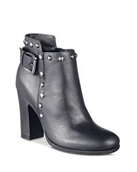 Pair these studded buckle booties from GUESS with a girly skirt or wax-coated jeans for a surprising take on seductive. Pair these studded buckle booties from GUESS with a girly skirt or wax-coated jeans for a surprising take on seductive.