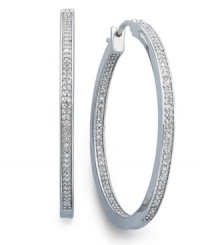 Icy cool. Round-cut diamonds (1/2 ct. t.w.) in a traditional hoop setting are a must-have for every girl's jewelry collection. Crafted in sterling silver. Approximate diameter: 1-1/2 inches. Icy cool. Round-cut diamonds (1/2 ct. t.w.) in a traditional hoop setting are a must-have for every girl's jewelry collection. Crafted in sterling silver. Approximate diameter: 1-1/2 inches.
