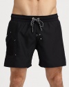 Classic swim trunk style, in a rich solid, finished with side pocket and signature logo detail.Drawstring elastic waistFully linedInseam, about 7PolyesterMachine washImported