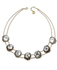 A natural inspiration. Swarovski's innovative gold tone mixed metal statement necklace features seven clear crystals in an exclusive cut. Each one is embellished with small crystals, creating breathtaking light reflections. Approximate length: 16-1/2 inches. A natural inspiration. Swarovski's innovative gold tone mixed metal statement necklace features seven clear crystals in an exclusive cut. Each one is embellished with small crystals, creating breathtaking light reflections. Approximate length: 16-1/2 inches.