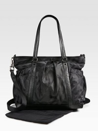 A large, nylon carryall for baby and mom with requisite checks, plenty of pockets, compartments and a matching changing pad.Double top handlesDetachable, adjustable shoulder strapTop zip closureElasticized side pocketsOpen inside pocketElasticized inner pocketTwo elasticized side bottle holdersFully linedAbout 13H X 15W X 6DNylon with leather trimSpot cleanImported A large, nylon carryall for baby and mom with requisite checks, plenty of pockets, compartments and a matching changing pad.Double top handlesDetachable, adjustable shoulder strapTop zip closureElasticized side pocketsOpen inside pocketElasticized inner pocketTwo elasticized side bottle holdersFully linedAbout 13H X 15W X 6DNylon with leather trimSpot cleanImported