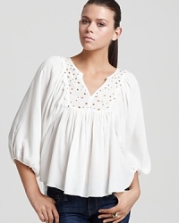 Embroidered cutouts and mirrored accents lend a rich artisan feel to this floaty Rebecca Taylor blouse. Embroidered cutouts and mirrored accents lend a rich artisan feel to this floaty Rebecca Taylor blouse.