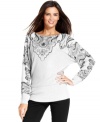 A pattern at the chest and sleeves elevates this metallic knit, dolman sleeve sweater from Alfani.