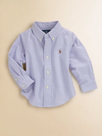 A classic button-down design is crafted in vibrant woven cotton for a clean, preppy style.Button-down collarLong sleeves with barrel cuffsButton-frontBox-pleated backShirttail hemCottonMachine washImported Please note: Number of buttons may vary depending on size ordered. A classic button-down design is crafted in vibrant woven cotton for a clean, preppy style.Button-down collarLong sleeves with barrel cuffsButton-frontBox-pleated backShirttail hemCottonMachine washImported Please note: Number of buttons may vary depending on size ordered.