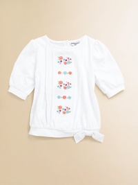 A charming short-sleeved top in soft cotton is accented with a blooming bouquet of embroidered flowers to inspire warm thoughts.Round necklineShort puff sleevesBack button closureTie hemCottonMachine washImported Please note: Number of buttons may vary depending on size ordered. A charming short-sleeved top in soft cotton is accented with a blooming bouquet of embroidered flowers to inspire warm thoughts.Round necklineShort puff sleevesBack button closureTie hemCottonMachine washImported Please note: Number of buttons may vary depending on size ordered.