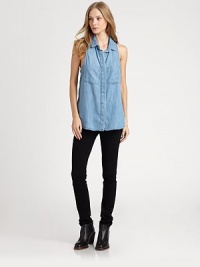 Button-down chambray shirt reinvented by a sleeveless silhouette, pleated racerback and split back hem that hits below the hips. Point collarHidden button frontSleevelessPleated racerbackSplit back hem hits below the hipsTencelMachine washMade in USA of imported fabricModel shown is 5'9 (176cm) wearing US size Small. Button-down chambray shirt reinvented by a sleeveless silhouette, pleated racerback and split back hem that hits below the hips. Point collarHidden button frontSleevelessPleated racerbackSplit back hem hits below the hipsTencelMachine washMade in USA of imported fabricModel shown is 5'9 (176cm) wearing US size Small.