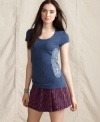 Look good while doing good! This beaded Tommy Hilfiger tee is part of a collection that benefits African communities.