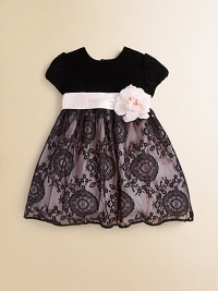 An elegant frock crafted in a puff sleeved with a velvet bodice, floral detail and delicate lace skirt.Round necklineShort puff sleevesBack buttonsWaistband with pleated silk sash and flowerFull skirtPolyester tulleDry cleanImported of domestic fabric Please note: Number of buttons may vary depending on size ordered. An elegant frock crafted in a puff sleeved with a velvet bodice, floral detail and delicate lace skirt.Round necklineShort puff sleevesBack buttonsWaistband with pleated silk sash and flowerFull skirtPolyester tulleDry cleanImported of domestic fabric Please note: Number of buttons may vary depending on size ordered.