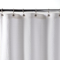 With exceptionally chic matelassé quilting, this shower curtain brings polished beauty to the bath. With exceptionally chic matelassé quilting, this shower curtain brings polished beauty to the bath.