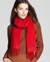 Burberry does up its solid scarf in a luxurious red cashmere with an embroidered horse detail.