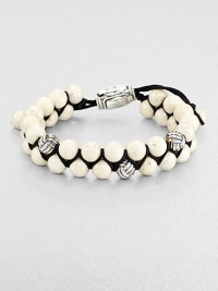 From the Spirited Bead Collection, this two-row beaded bracelet is handsomely crafted from 8mm river stone beads, featuring three silver monkey fist beads and an adjustable clasp.Sterling silverRiver stoneAbout 9 longAbout 3 diam.Imported