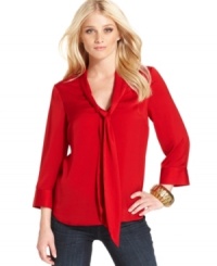 A tie at the neckline adds a retro appeal to this Kensie blouse -- perfect for work and beyond! A tie at the neckline adds a retro appeal to this Kensie blouse -- perfect for work and beyond!