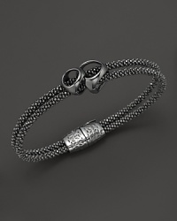 Di MODOLO's iconic sig piece is strung on a double strand bracelet, crafted in rhodium plated sterling silver.