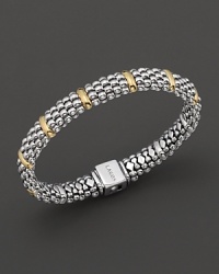 Ten golden dividers on the sterling silver Caviar™ beaded oval rope bracelet, designed by Lagos. Ten golden dividers on the sterling silver Caviar™ beaded oval rope bracelet, designed by Lagos.