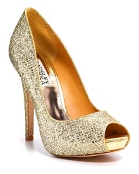 Add some glamour to a simple dress: Goldtone, glitter peep toe pumps with a tall covered heel and platform. Add some glamour to a simple dress: Goldtone, glitter peep toe pumps with a tall covered heel and platform.