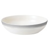 A watercolor wash of gradient gray migrates toward a warm neutral center to create an organic ombre effect on this durable, adaptable bowl from Vera Wang.