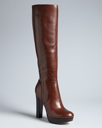 Long on sophisticated style, these MICHAEL Michael Kors tall platform boots are a daily wardrobe staple. Dress them up or down. Long on sophisticated style, these MICHAEL Michael Kors tall platform boots are a daily wardrobe staple. Dress them up or down.