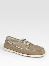 Classically constructed in stretchy canvas, this rugged staple has suede trim and signature laces. Rubber soleImported Classically constructed in stretchy canvas, this rugged staple has suede trim and signature laces. Rubber soleImported