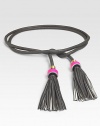 A soft, supple leather style with playful tassels and a tie closure. Width, about ½Imported 